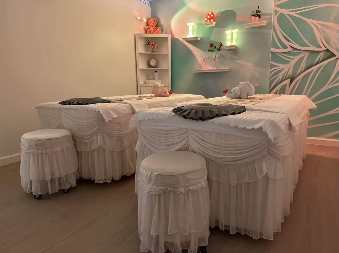 Warmly lit couples treatment room